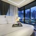 Tastoria Collection Sukhumvit room with king bed and city skyline view in Bangkok