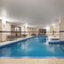 Residence Inn by Marriott Montreal Airport indoor pool with seating area in Montreal