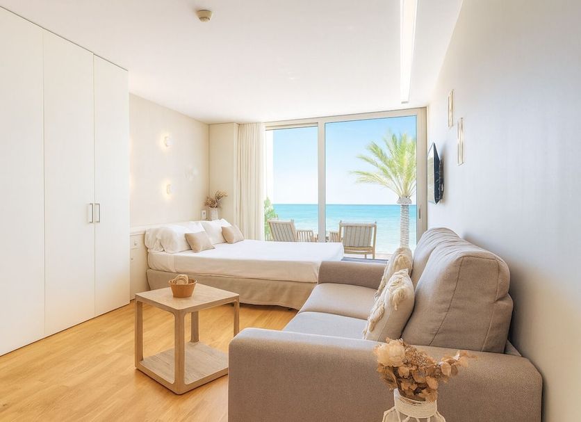 Meraki Beach Hotel - Adults Only in La Pobla de Farnals room with sea view, sofa and balcony