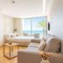 Meraki Beach Hotel - Adults Only in La Pobla de Farnals room with sea view, sofa and balcony