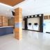 Lavana Hotel Batu Caves lobby with reception desk, wood-accent wall and polished tile floor