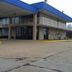 Express Inn West Memphis exterior with two-story entrance, blue roof, and covered balconies