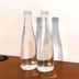 Infinite Residence Bandung room with two glass water bottles on a wooden table