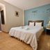 Baan Suksiri Hotel Hua Hin bedroom with double bed, bedside lamp, and tiled floor