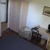 Flegrea House - Casa Rosa room in Pozzuoli with bed, desk, chair and wardrobe