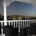 Hotel Citadel Narikala terrace with wicker chairs and panoramic Tbilisi city views
