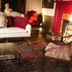 Bailey House in Annapolis Royal with an elegant sitting room, sofa, patterned rug and fireplace