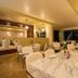 Coral Island Beach View Hotel in Mazatlán dining room with marble-top tables and warm lighting