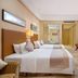 Power Valley International Hotel in Baoding guest room with two twin beds, TV, and work desk