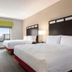 Holiday Inn Express & Suites Canton guest room with two beds and city view from window
