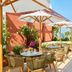 The Hollywood Grande, Autograph Collection in Los Angeles rooftop terrace with tables, umbrellas, and city views