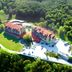 Gazelle Resort & Spa in Karacasu surrounded by forest with red-roofed buildings and outdoor parking