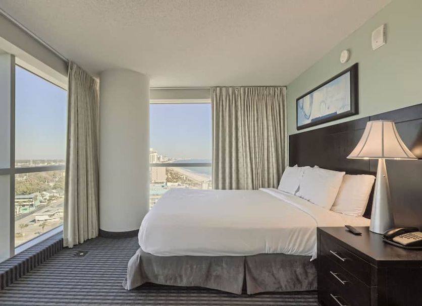 Oceans One Resort in Myrtle Beach guest room with ocean view and floor-to-ceiling windows
