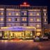 Sun Park Resort, Chandigarh exterior at night with lit facade and illuminated entrance