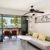 Katathani Phuket Beach Resort, Karon: ocean-view suite with balcony seating and palm trees