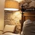 Posada Mayor de Migueloa, Laguardia: rustic guest room with stone wall, wood headboard and lamp