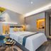 Home Inn Style Shanghai Dahua Xincun Road Metro Station guest room with double bed and armchair in Shanghai