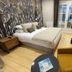 Le Clos Du Galion - Ile De Ré room with king bed, balcony doors, TV and seating in Saint-Martin-de-Ré