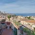 Il Camaleonte dal 2005 in Bracciano terrace with potted plants and lake view over town