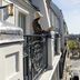 Hotel Louvre Montana balcony view over Paris street and rooftops from a classic Paris hotel