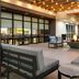 Home2 Suites by Hilton Alexandria patio lounge with fire pit and cushioned seating