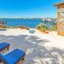 Surf & Sand Hotel in Pensacola Beach with beach loungers, red umbrellas, and waterfront views