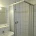 Hotel Am Markt in Eckartsberga bathroom with tiled shower stall and sink