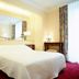 Romantik Hotel Wilden Mann Luzern guest room with double bed and mirrored wall in Lucerne