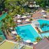 Melia Santiago De Cuba in Santiago de Cuba with outdoor pools, palm trees and lounge chairs