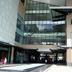 Guijo Suites Makati in Makati, modern hotel exterior with glass facade and covered entrance
