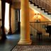 Dwór Sieraków in Sieraków, Małopolskie: grand staircase beside a piano and decorative column interior