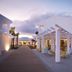 Robinson Cabo Verde - Adults Only in Santa Maria with modern white villas, palm trees, and a sunset walkway