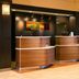 Courtyard by Marriott Kansas City East/Blue Springs lobby with dual front desk and modern wood counters