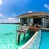 The Residence Maldives, Falhumaafushi: overwater villa with deck and steps into turquoise lagoon
