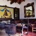 Hacienda La Magdalena in Zapopan lobby with rustic seating, fireplace and decorative altar