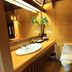 Belle Villa Resort, Pai bathroom with vessel sink, toilet and warm lighting