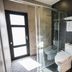 The Silence Manor in Ruisui Township bathroom with glass shower, toilet, and towel rack