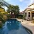 Happy Valley House Phoenix courtyard pool with palm trees and patio