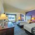La Quinta Inn & Suites by Wyndham Loveland/Estes Park guest room with two beds and mountain-view window