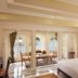 Taj Fateh Prakash Palace Udaipur bedroom with lake-view balcony seating and ornate arched doors