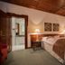 Romantik Hotel Zur Schwane, Volkach: cozy guest room with double bed, lamps, wood ceiling and private bathroom