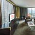Swiss-Belhotel Mangga Besar Jakarta room with sofa, city view, and king bed