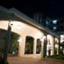 Constellation Hotel in Port Au Prince at night, showing a lit covered entrance and courtyard walkway