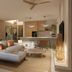 Maradiva Villas Resort & Spa in Flic en Flac: airy villa living room with kitchen, lounge area and bar stools