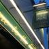 The Green Man in Rugby exterior with illuminated sign at dusk