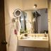El Serafin Hotel Boutique in Santiago de Querétaro bathroom with wall-mounted sink, mirror, and ring lights