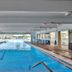 Pinnacle Port A-305 indoor pool in Panama City Beach with lap lanes and lounge chairs