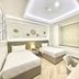 Bisanta Bidakara Surabaya twin room in Surabaya with two single beds and a desk