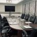 Haywood Park Hotel in Asheville boardroom with oval conference table and black leather chairs