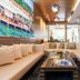 Jpark Island Resort & Waterpark in Lapu-Lapu City lobby with cream sofas, wood table and tropical wall art